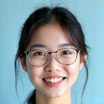 Portrait of Jenna Lee, a smiling Korean female instructor with glasses.